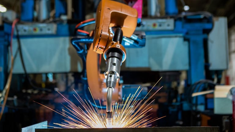  Robotic arm performs a welding task 